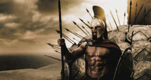 A Spartan Warrior Standing On A Hill Wallpaper