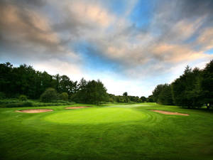 A Striking Scenic Aerial View Of A Golf Course Wallpaper