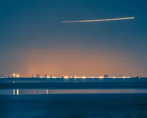 A Stunning Comet Soaring Through The Night Sky Wallpaper
