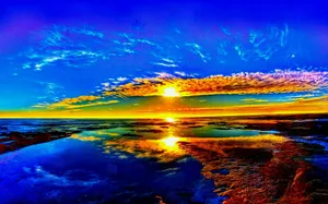 A Sunset With A Reflection In The Water Wallpaper