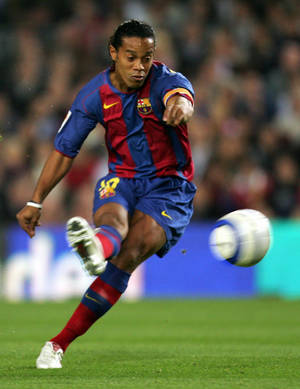 A Team Of Talented Soccer Players Taking Part In A Match. Wallpaper