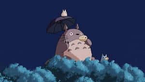 A Totoro Sitting On A Tree With An Umbrella Wallpaper