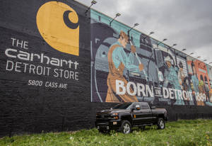 A Truck Parked In Front Of A Mural Wallpaper