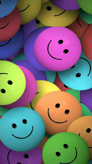 A Vibrant Array Of Smile Emoji Pebbles Wallpaper