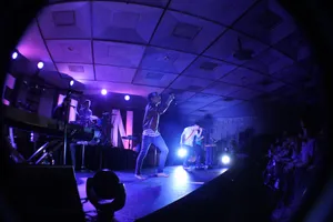 A Vibrant Sunset Over A Tranquil Forest Landscape Wallpaper