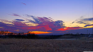 A Vibrant Sunset Over Kansas Wallpaper