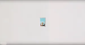 A White Wall With A Picture Of A Woman In A Window Wallpaper