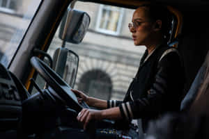 A Woman Driving A Truck Wallpaper