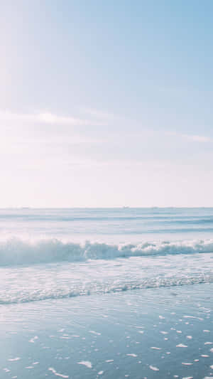 A Woman Is Standing On The Beach Wallpaper