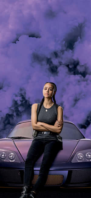 A Woman Sitting On Top Of A Purple Sports Car Wallpaper