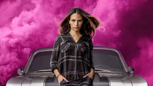 A Woman Standing Next To A Car With Pink Clouds Wallpaper