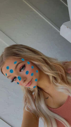 A Woman With Blue Dots On Her Face Wallpaper