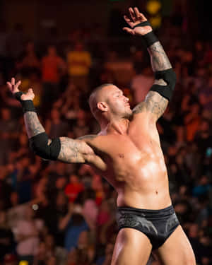 A Wrestler With Tattoos In The Air Wallpaper