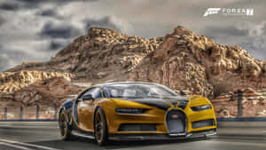 A Yellow And Black Car Driving Down A Road Wallpaper