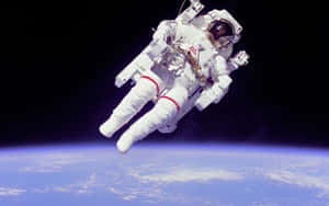 A Young Astronaut Explores The Vastness Of Space Wallpaper