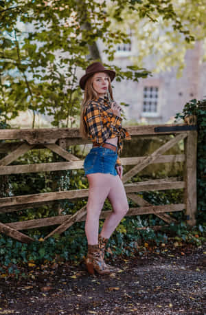 A Young Country Girl Dressed In A Plaid Shirt, Ready For A Summer Adventure. Wallpaper