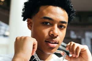 A Young Man With A Necklace On His Neck Wallpaper