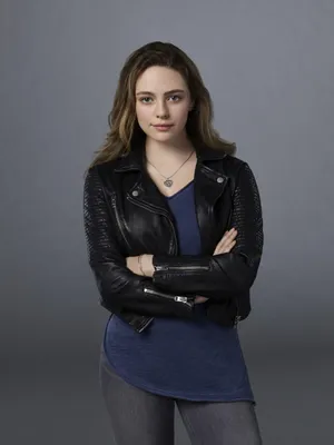 A Young Woman In A Black Leather Jacket Wallpaper