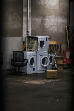 Abandoned Washing Machinesin Warehouse Wallpaper