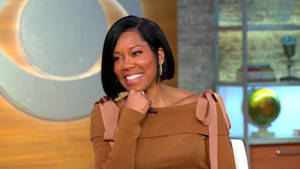 Actress Regina King In A Chic Brown Dress Wallpaper