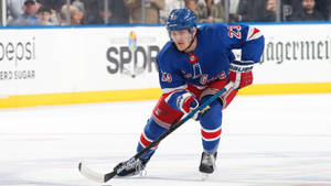 Adam Fox Blue New York Rangers Maneuvering Wallpaper