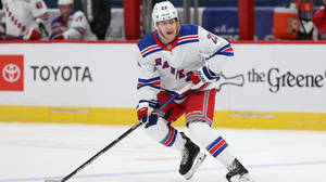 Adam Fox White New York Rangers On Game Wallpaper