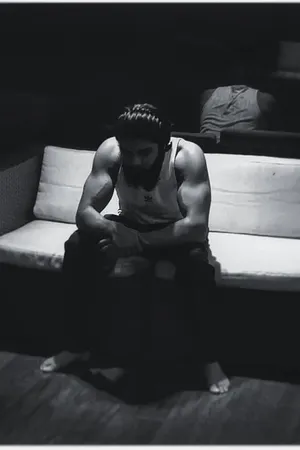 Adithya Varma Contemplating Alone On Couch Wallpaper