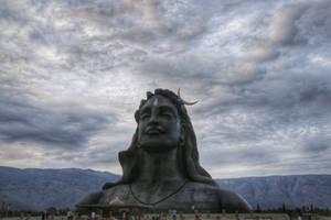 Adiyogi Shiva On A Cloudy Day Wallpaper