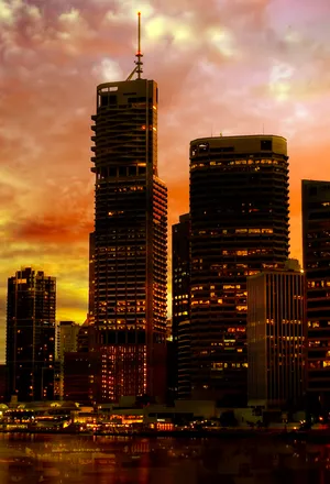 Admire The City At Sunset From Your Iphone Wallpaper