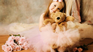 Adorable Baby Girl In A Pink Dress Wallpaper