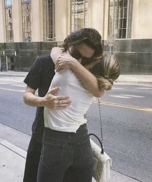 Adorable Couple Sharing A Sweet Moment Wallpaper