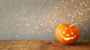Adorable Halloween Pumpkin On Autumn Leaves Wallpaper