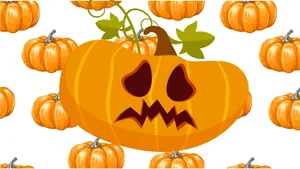 Adorable Little Pumpkin Surrounded By Autumn Leaves Wallpaper