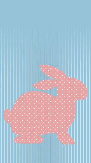 Adorable Pink Bunny Hopping Through A Grassy Meadow Wallpaper