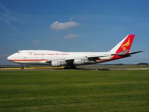 Aerial View Of A Jumbo Jet Soaring Through The Clouds. Wallpaper