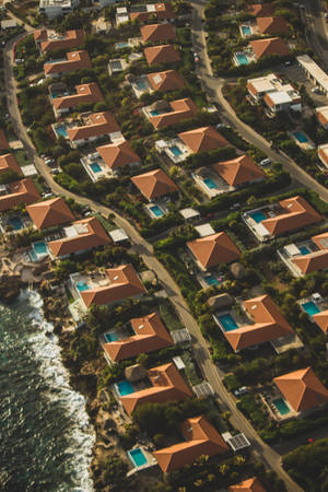 Aerial View Of Colorful Seaside Houses Wallpaper