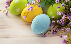 Aesthetic Easter Eggs And Purple Flowers Wallpaper