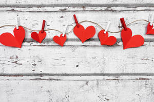 Aesthetic Heart Paper Cutouts On String Wallpaper