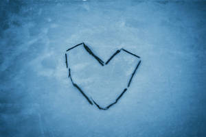 Aesthetic Heart Symbol In The Snow Wallpaper