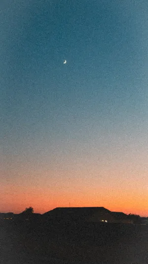 Aesthetic Sunset With House Silhouette Wallpaper