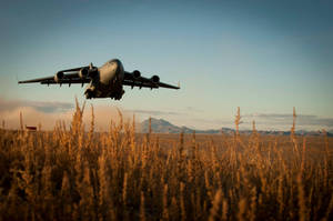 Afghanistan Military Aircraft Above Field Wallpaper