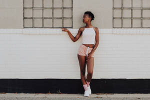 African Teenage Girl Wearing Shorts Wallpaper