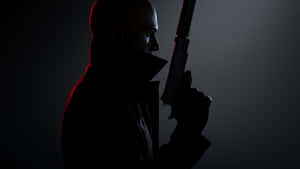 Agent 47 Sneaking Through The Shadows In Hitman 3 Wallpaper