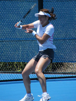 Ai Sugiyama Firing Off A Powerful Tennis Shot. Wallpaper