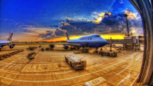 Airplane And Cargo On Runway Wallpaper