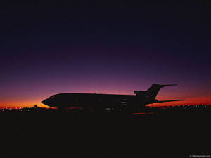Airplane At Sunset Wallpaper