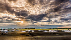 Airplanes Parked On Runway Wallpaper