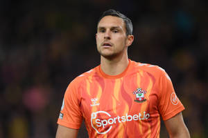 Alex Mccarthy In Orange Jersey Wallpaper