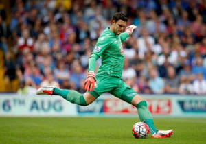 Alex Mccarthy Kicking A Soccer Ball Wallpaper