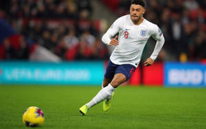 Alex Oxlade-chamberlain Playing Football Wallpaper